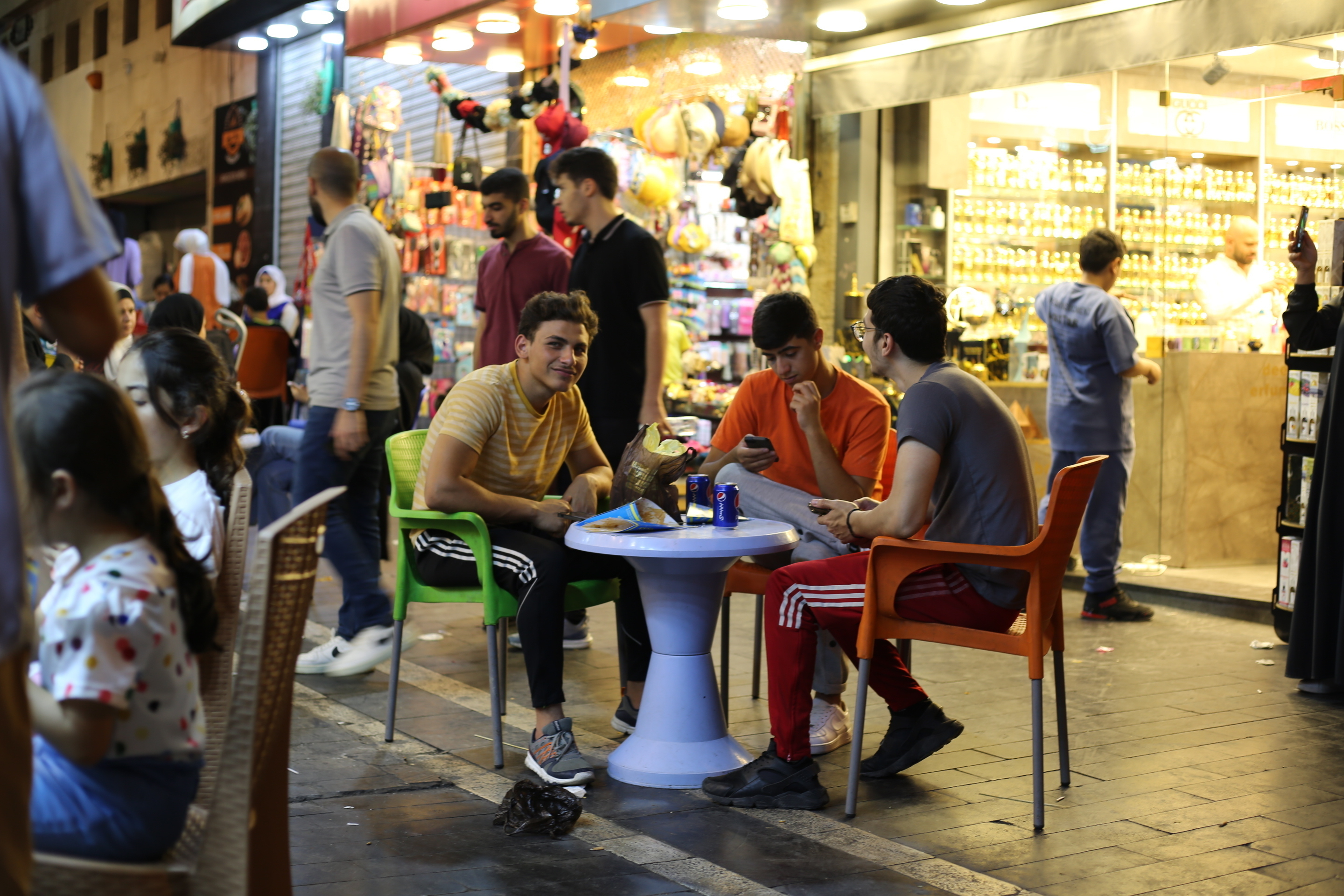 Friends hanging out in downtown Amman © Nathalie Bertrams/GAGE 2024