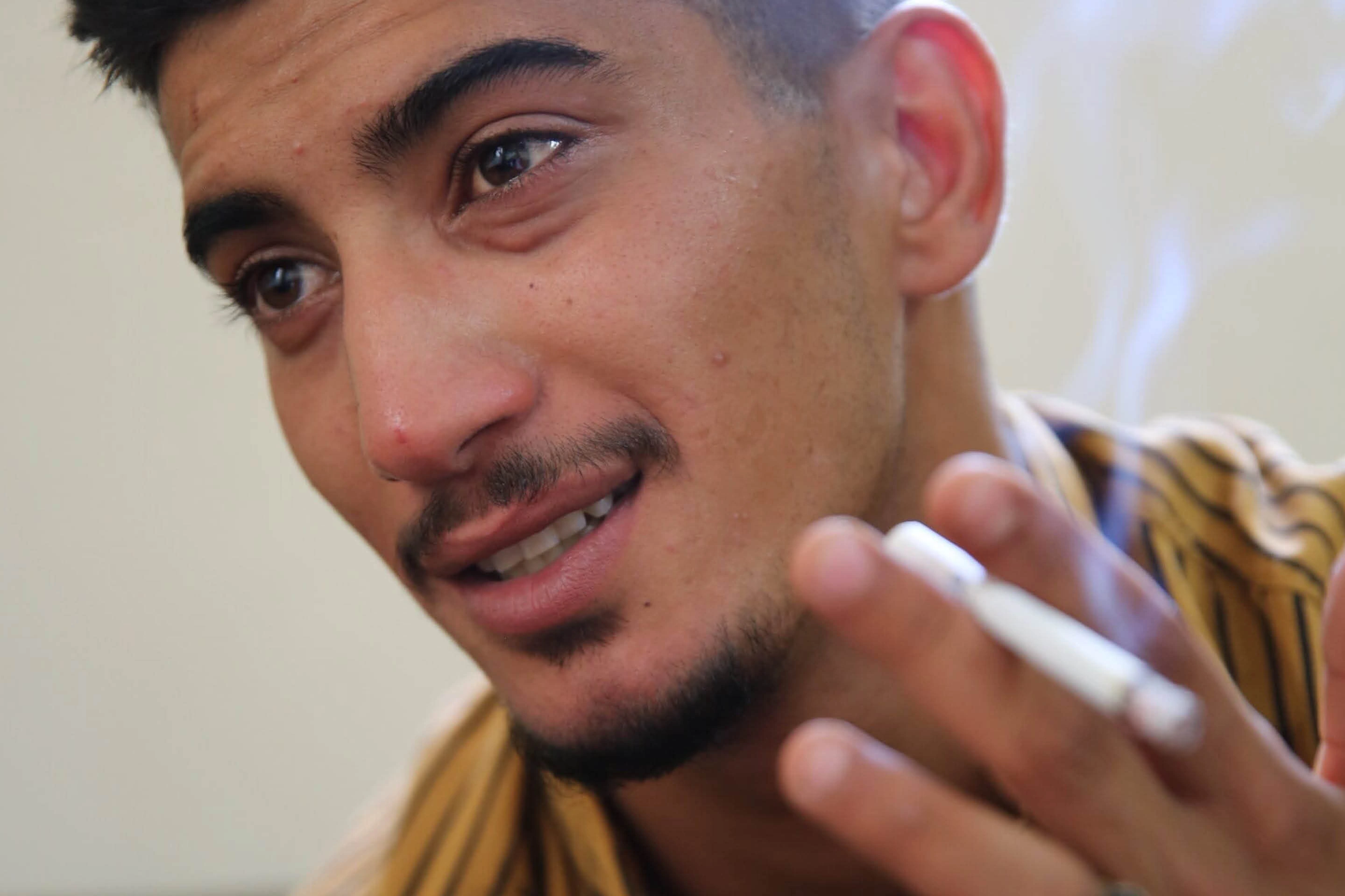Young Jordanian man smoking